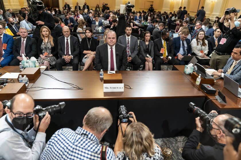 WASHINGTON, DC - JUNE 13: Photographers jostle for position as witness Chris Stirewalt, a former Fox News political editor who was fired by the network, best ready to testify during a hearing before the House Select Committee to Investigate the January 6th, in the Cannon House Office Building on Monday, June 13, 2022 in Washington, DC. The bipartisan Select Committee to Investigate the January 6th Attack On the United States Capitol has spent nearly a year conducting more than 1,000 interviews, reviewed more than 140,000 documents day of the attack. (Kent Nishimura / Los Angeles Times)