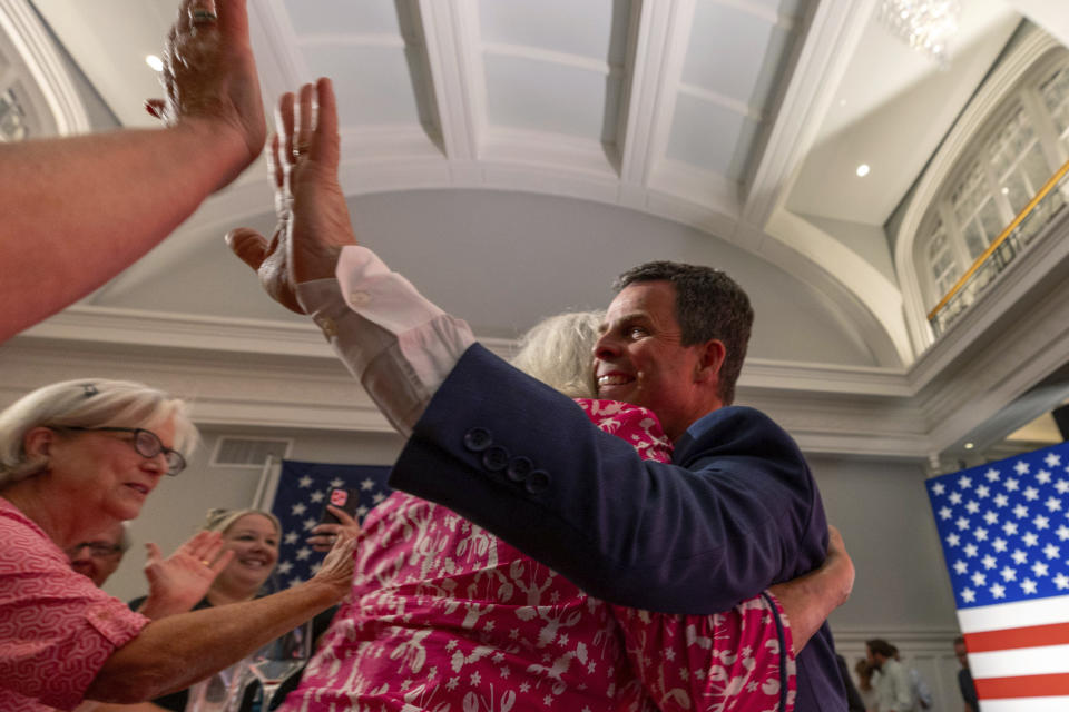 Virginia state Sen. John McGuire, a candidate in the Republican primary in the state's 5th Congressional District, joins supporters Tuesday night, June 18, 2024, in Lynchburg, Va. (AP Photo/Skip Rowland)