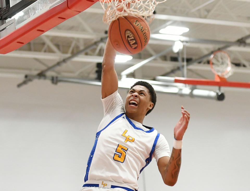 Lincoln Park’s Meleek Thomas dunks the ball during Friday’s PIAA Class 4A quarterfinal game against North Catholic at Fox Chapel High School.