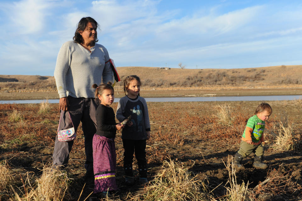 A family from the Cheyenne River tribe plays together near Turtle Island during a protest.