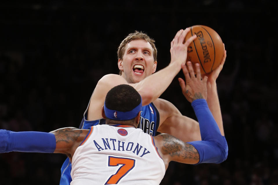 Dallas Mavericks' Dirk Nowitzki works to get open before shooting the game-winning basket against New York Knicks' Carmelo Anthony (7) in the final seconds of an NBA basketball game Monday, Feb. 24, 2014, in New York. Dallas won 110-108. (AP Photo/Jason DeCrow)