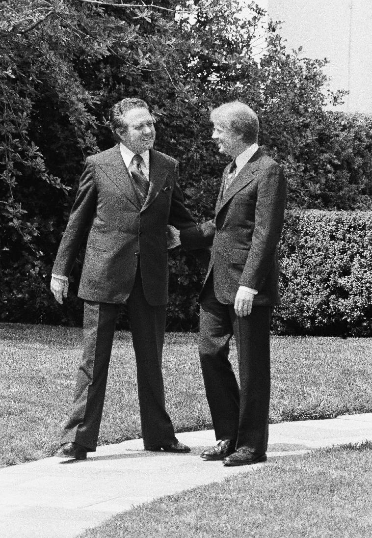 FILE - In this April 21, 1977 file photo, Pres. Jimmy Carter, right, bids goodbye to Portuguese Prime Minister Mario Soares, left, outside the Oval Office of the White House in Washington, D.C. Portugal's Socialist Party, which Soares once led, said he died Saturday, Jan. 7 2017, at the age of 92. Soares had been hospitalized seen Dec. 13 2016. (AP Photo/Charles Bennett, file)