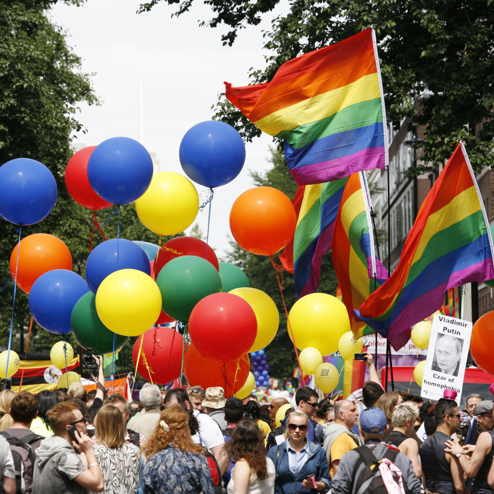 London, UK - June 29, 2013: Rainbow flag and baloons in London's Gay Pride, people present, estimated 25,000 people took part in the march, Parade to support gay rights.
