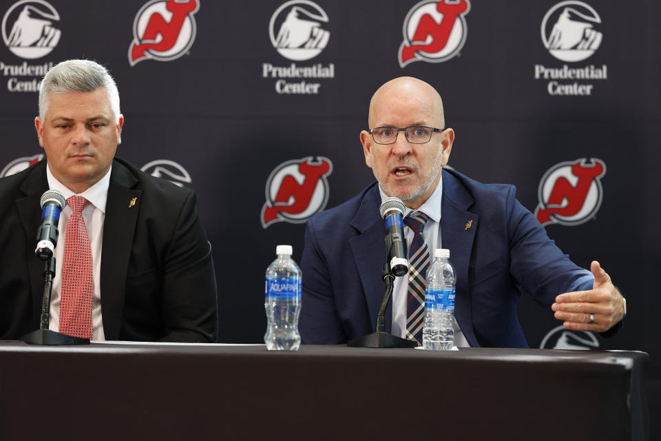 New Jersey Devils general manager Tom Fitzgerald talks about the hiring of new NHL hockey team head coach Sheldon Keefe, left, during press conference Tuesday, May 28, 2024, in Newark, N.J. (AP Photo/Noah K. Murray)