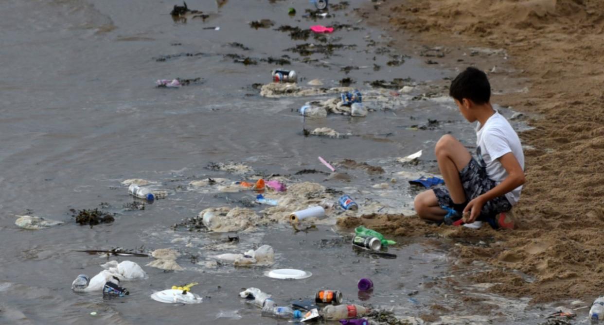  Discarded plastic waste, beers cans, fizzy pop bottles and crisp packets were left littering Blackpool Beach (SWNS)