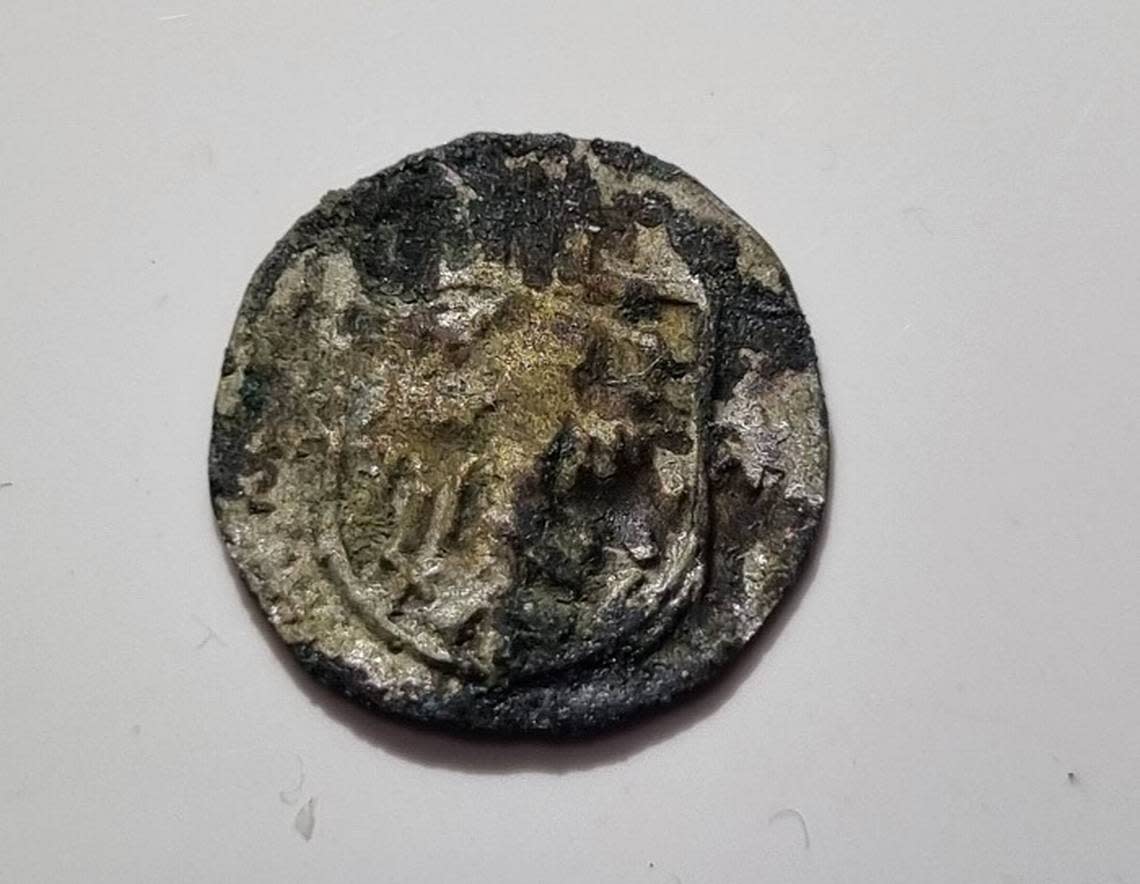 A 15th century coin found at the site. Photo from M. Supernak via Science in Poland