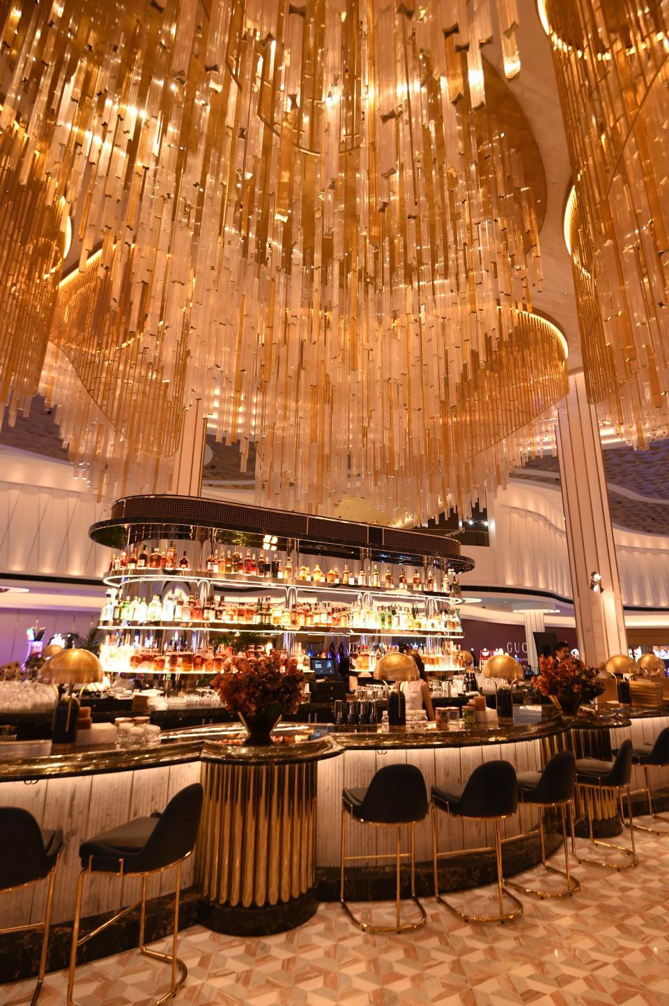 Golden chandeliers above a bar in Fontainebleau Las Vegas.