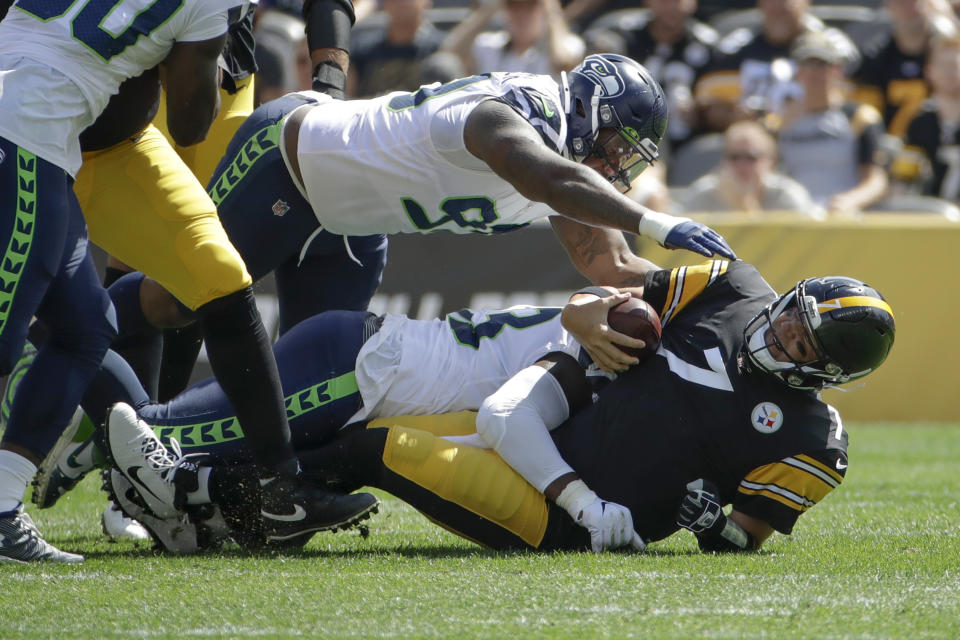 Pittsburgh Steelers quarterback Ben Roethlisberger (7) is sacked by Seattle Seahawks defensive end Rasheem Green (98) and Jadeveon Clowney/ (AP)