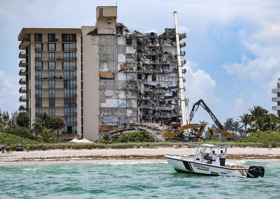 The partial collapse of the Champlain Towers South, pictured above in 2021, moved Florida lawmakers to implement new financial reserve and inspection regulations. Years later, those changes are creating rising financial pressures for existing high-rise owners, motivating many to work together to sell their entire building to developers. Al Diaz/adiaz@miamiherald.com