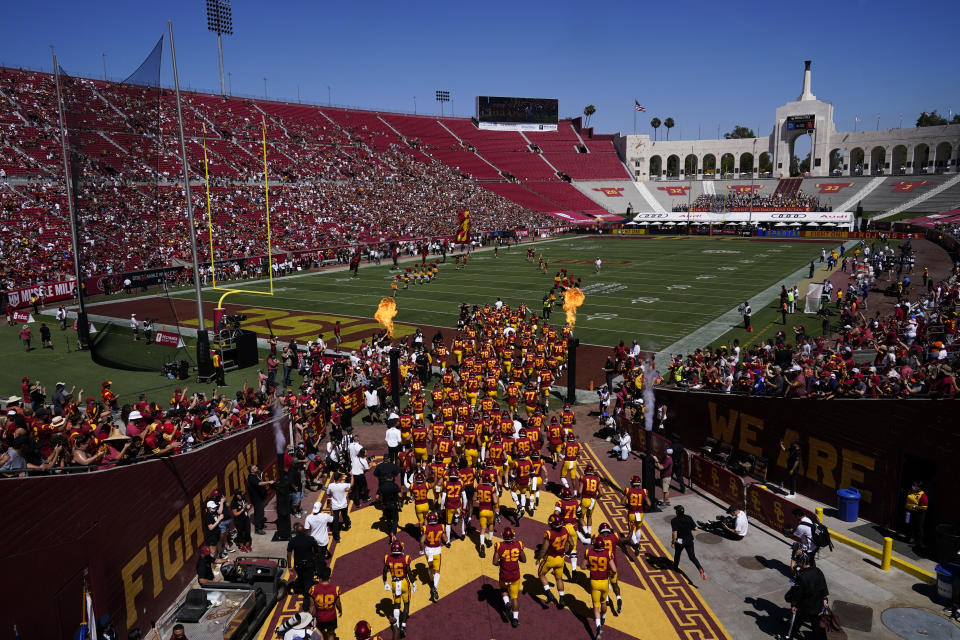 Southern California players enter the stadium before an NCAA college football game against San Jose State Saturday, Sept. 4, 2021, in Los Angeles. (AP Photo/Ashley Landis)