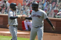 Cleveland Indians' Tyler Naquin, left, is congratulated by teammate Franmil Reyes after hitting a two-run home run during the second inning of a baseball game against the St. Louis Cardinals, Sunday, Aug. 30, 2020, in St. Louis. (AP Photo/Scott Kane)