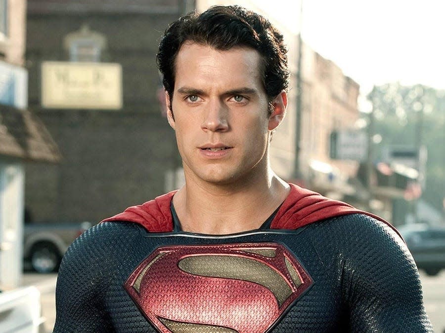 Henry Cavill as Superman standing in Smallville.