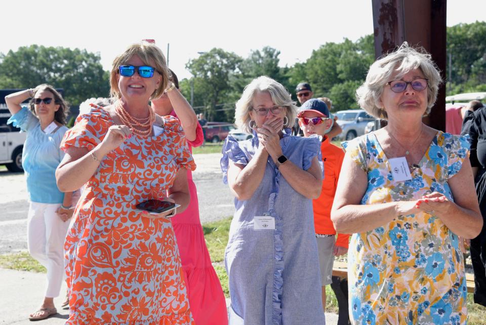 Robert Doane’s daughters Susan O’Connor, Mary Lewis and Kathleen Eckhardt react to seeing the TBM Avenger Torpedo Bomber flying around Monmouth Executive Airport on Saturday, July 22, 2023 in Wall, New Jersey. 