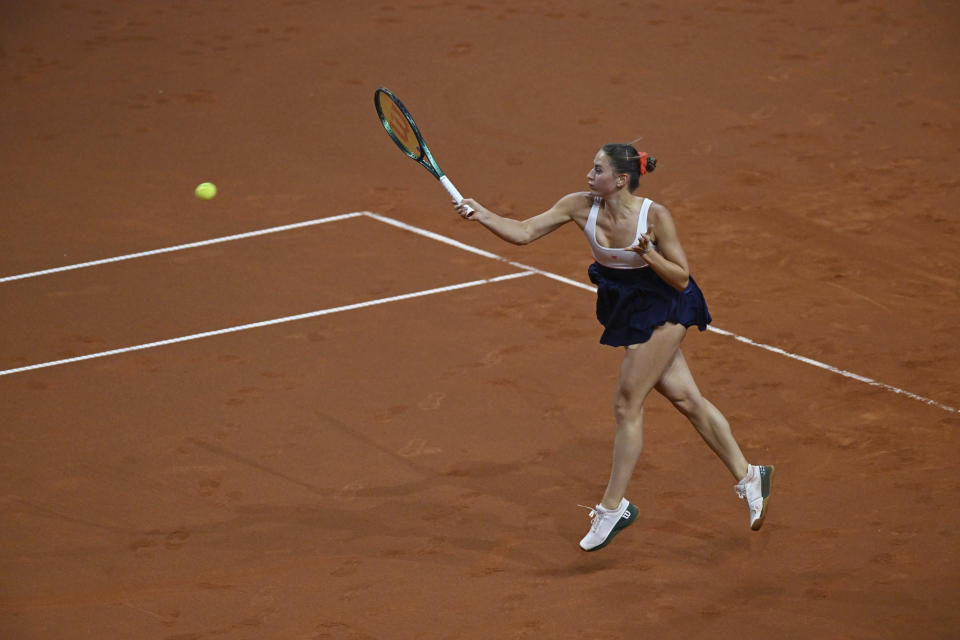 Ukraine's Marta Kostyuk returns the ball against Czech Republic's Vondrousova during their semifinal match of the WTA Tour against, in Stuttgart, Germany, Saturday April 20, 2024. (Marijan Murat/dpa via AP)