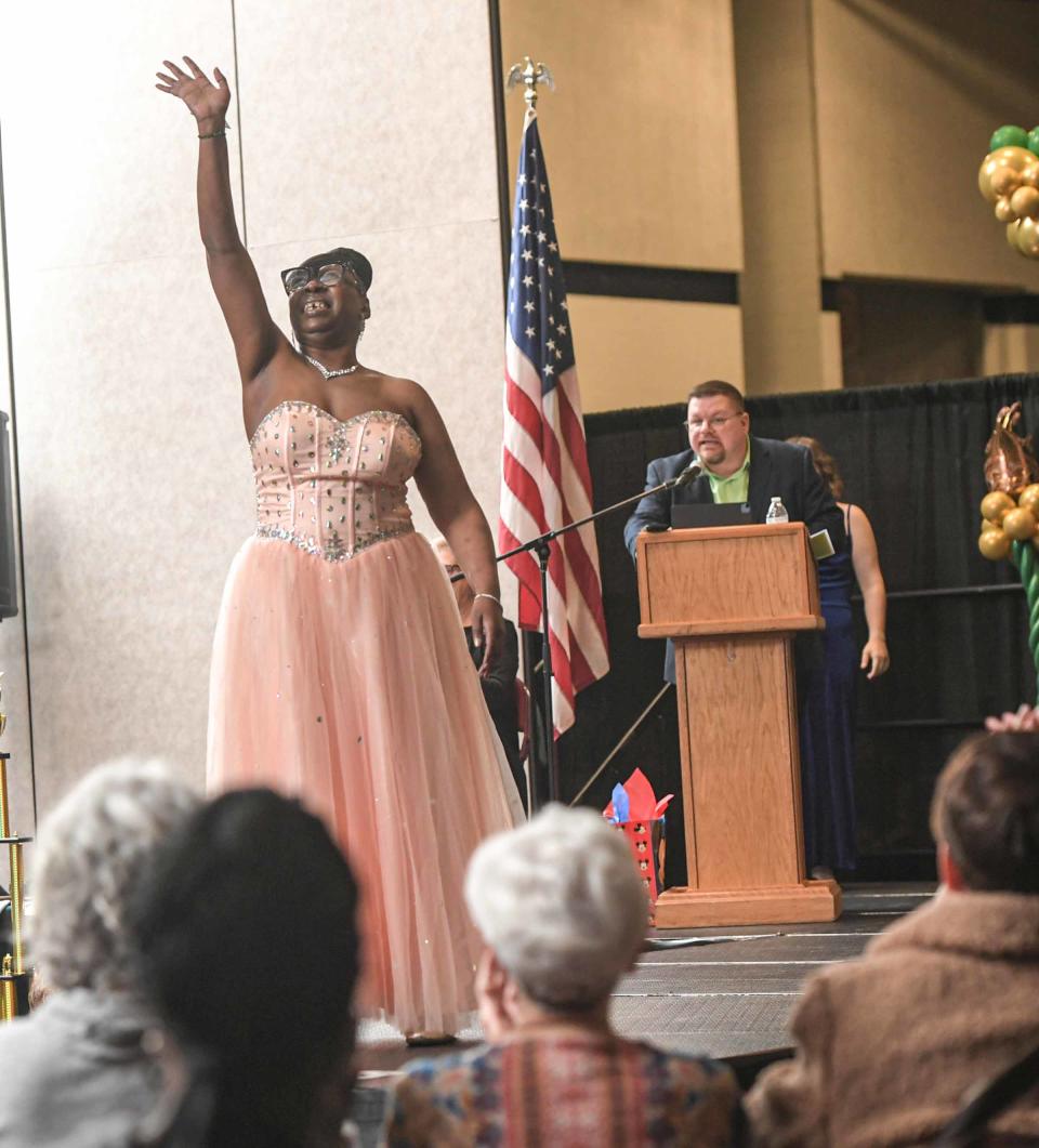 Shamika Eastrich waves on the catwalk during the 6th annual Area 14 Anderson County Special Olympics 2024 You Are Beautiful Pageant at the Civic Center in Anderson, S.C. Thursday, January 18, 2024. Shamika Eastrich won best hair award.