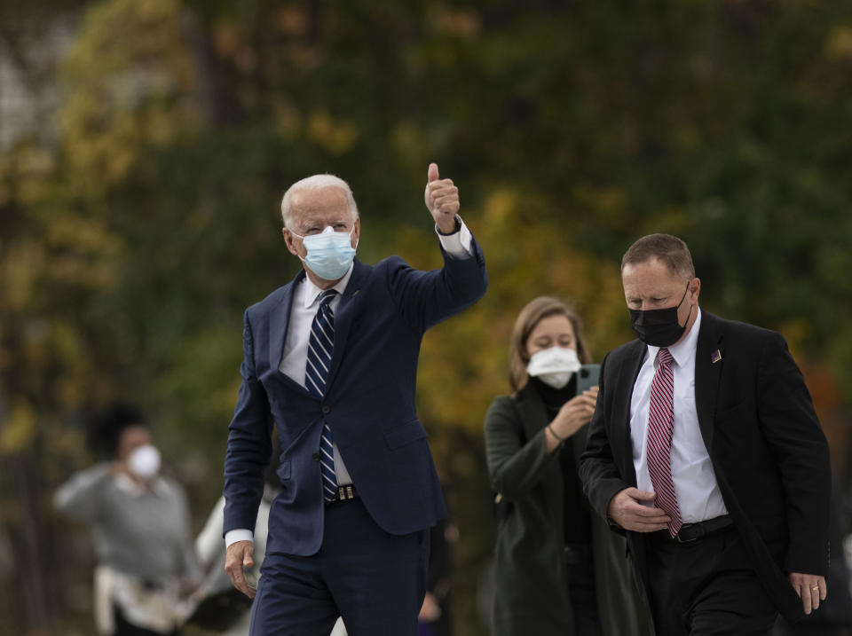 Democratic presidential candidate former Vice President Joe Biden looks to supporters and members of the press while arriving to a campaign event Friday, Oct. 16. 2020 in Southfield, Mich. (Nicole Hester/Ann Arbor News via AP)