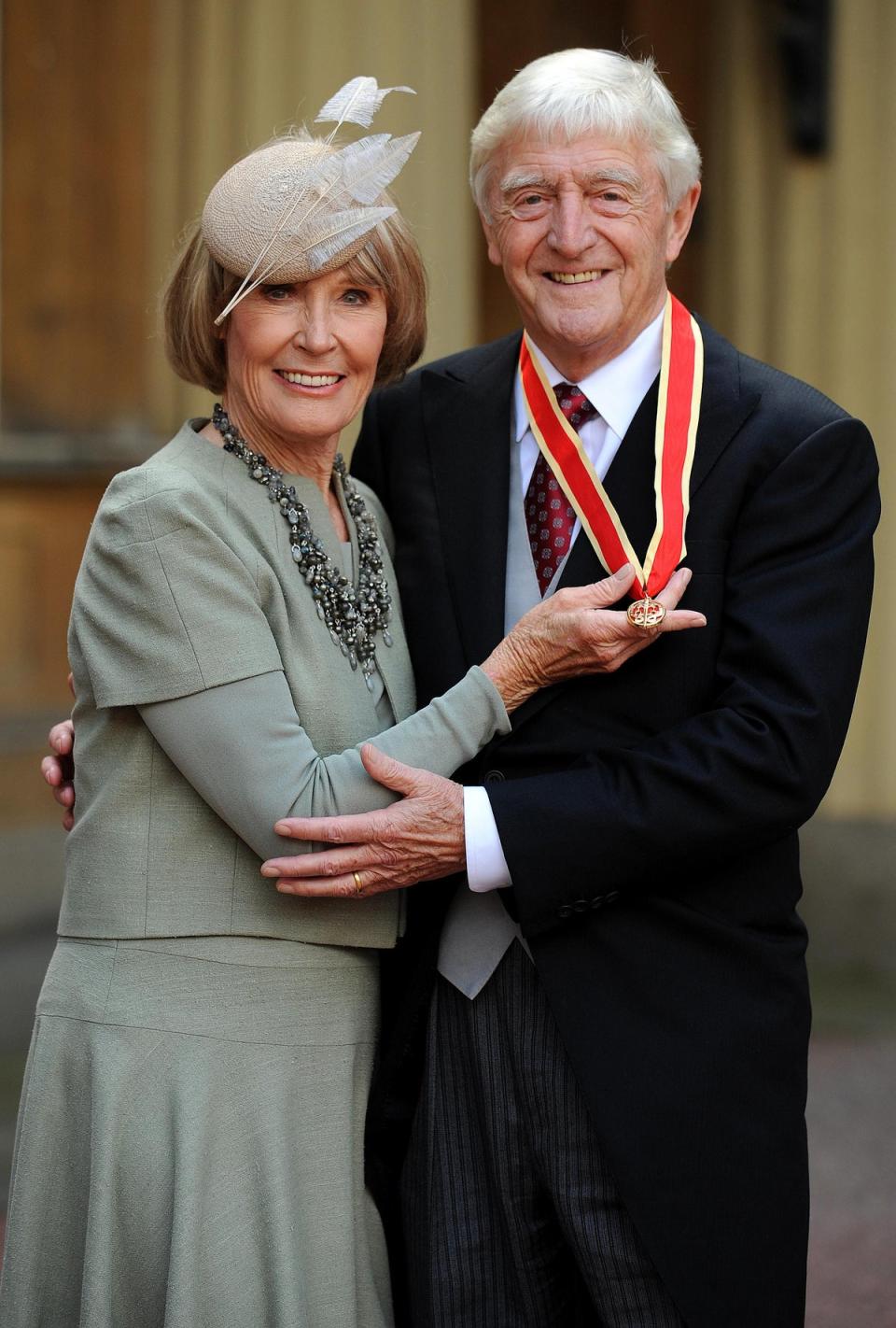 Sir Michael Parkinson accompanied by his wife Lady Mary Parkinson after receiving his Knighthood in 2008 (PA)