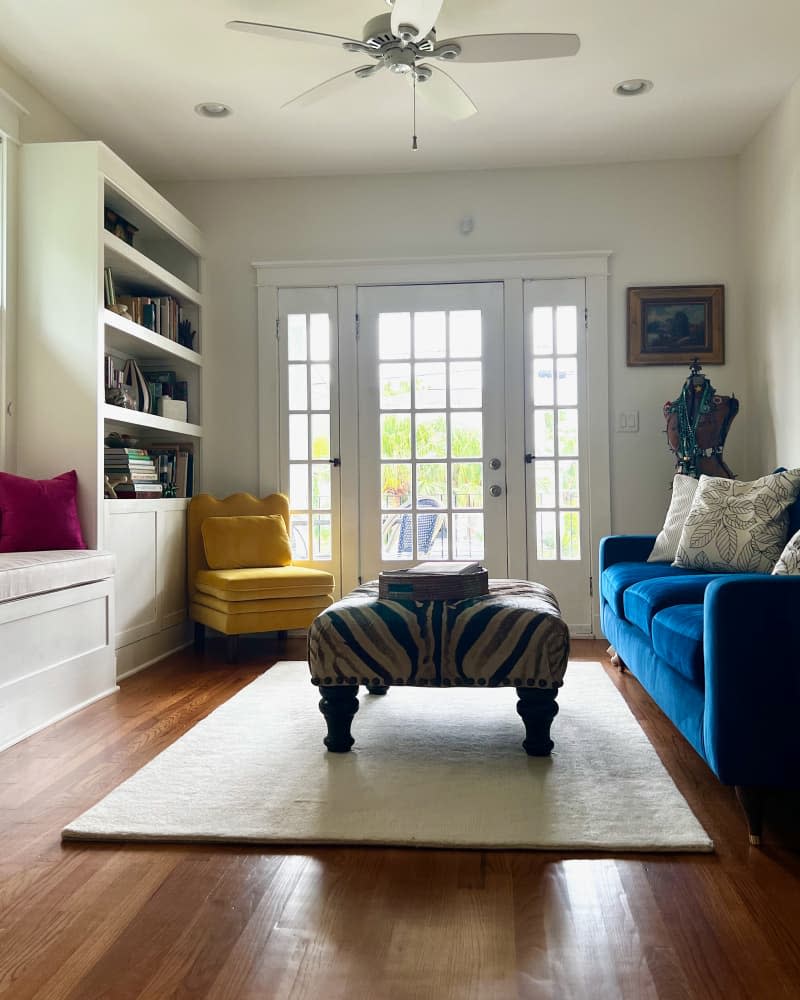 Zebra printed ottoman in living room after renovation.