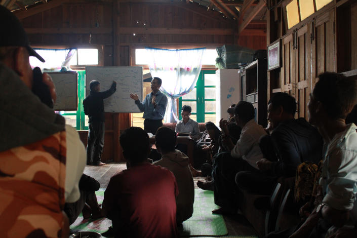 A village in Thantlang township holds an annual meeting on Sept. 4 to distribute farmland to each household for the year ahead. This year, they redistributed the land to include displaced people from Thantlang town who are now sheltering in the village.<span class="copyright">Emily Fishbein</span>