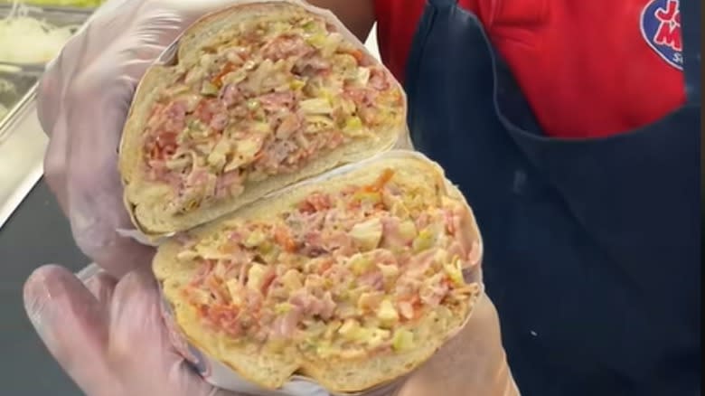 Cross-section of chopped ham and cheese sub