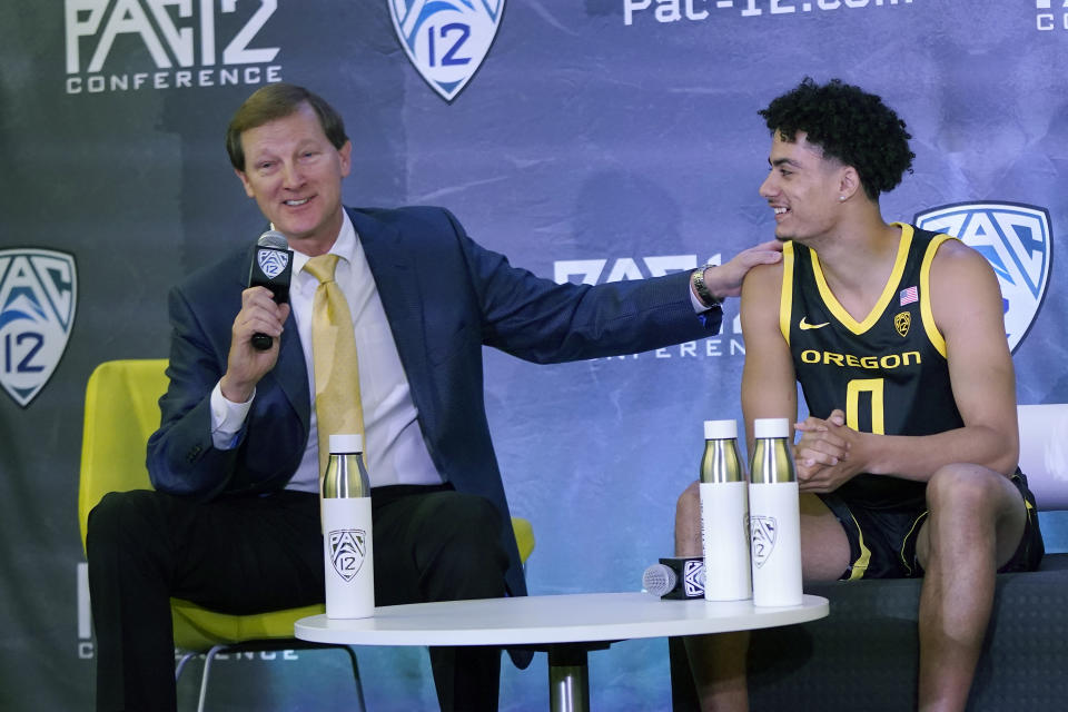 Oregon head coach Dana Altman, left, speaks next to Will Richardson during Pac-12 Conference NCAA college basketball media day Wednesday, Oct. 13, 2021, in San Francisco. (AP Photo/Jeff Chiu)