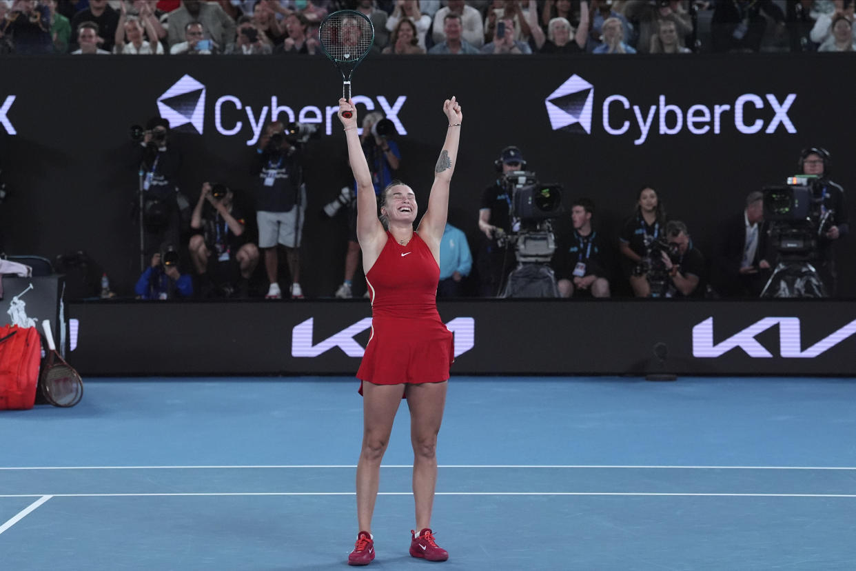 Aryna Sabalenka of Belarus celebrates after defeating Zheng Qinwen of China in the women's singles final at the Australian Open tennis championships at Melbourne Park, Melbourne, Australia, Saturday, Jan. 27, 2024. (AP Photo/Andy Wong)