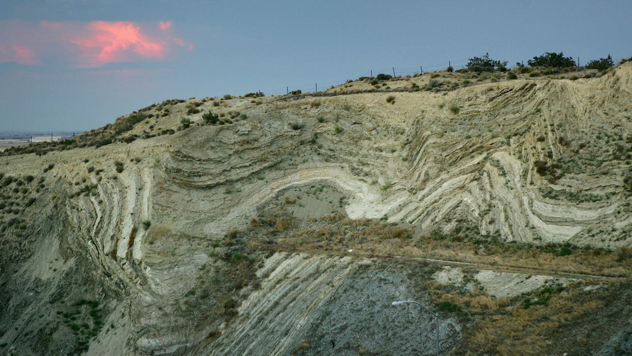  Layers of earthquake-twisted ground are seen at dusk where the 14 freeway crosses the San Andreas Fault on June 28, 2006 near Palmdale, California. 