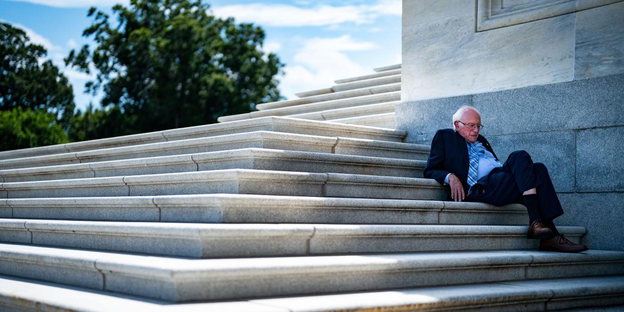 Sen. Bernie Sanders (I-VT), whose amendment was defeated 1-99, sits in the shade on the steps of the Senate as the Senate proceeds through a series of amendment votes, also called "vote-a-rama, on the Inflation Reduction Act at the U.S. Capitol on Sunday, Aug. 7, 2022 in Washington, DC.