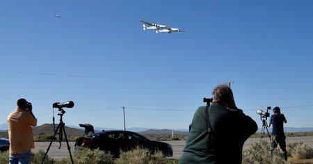 The world's largest airplane, built by the late Paul Allen's company Stratolaunch Systems, makes its first test flight in Mojave, California, U.S. April 13, 2019. REUTERS/Gene Blevins