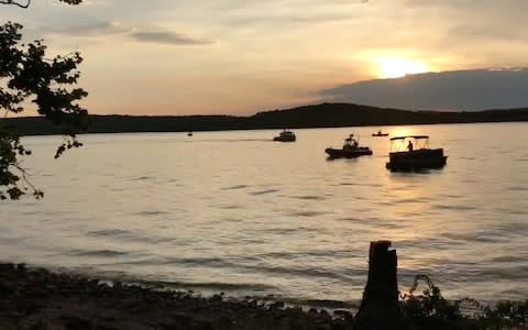 Rescue personnel work after an amphibious "duck boat" capsized and sank, at Table Rock Lake near Branson, Stone County - Credit: Reuters