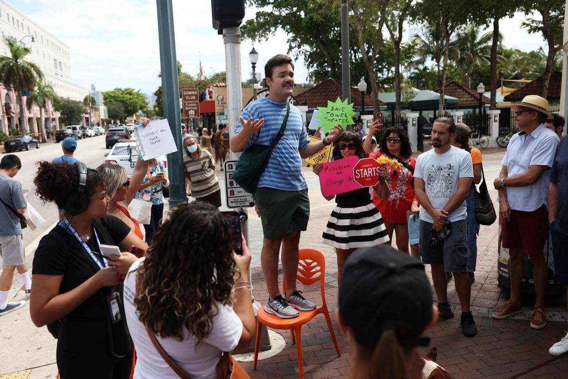 Chris Molina, local filmmaker, stands up to speak on a chair outside of Tower Theater during the Miami Dade College Tower Theater protest on Tuesday, Oct. 4, 2022, in Little Havana.