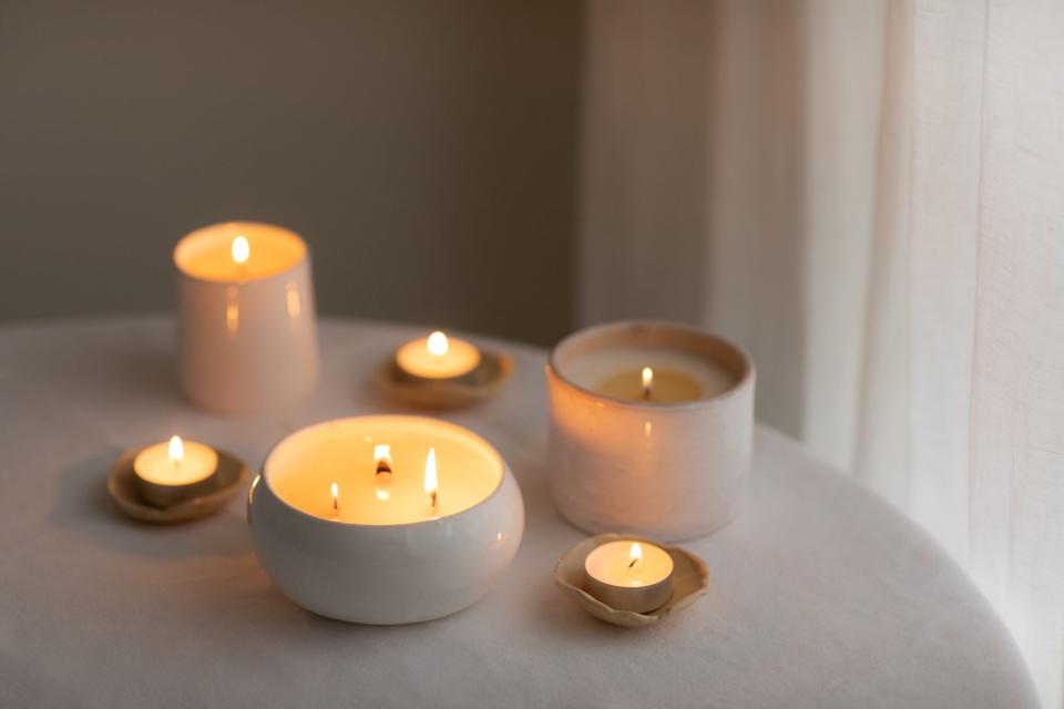 differently shaped lit candles