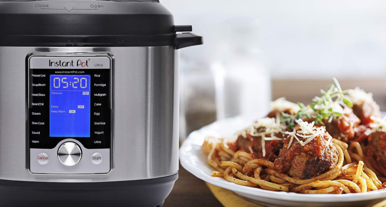  Instant Pot Ultra 60 10-in-1 Electric Pressure Cooker next to plate of spaghetti and meatballs 