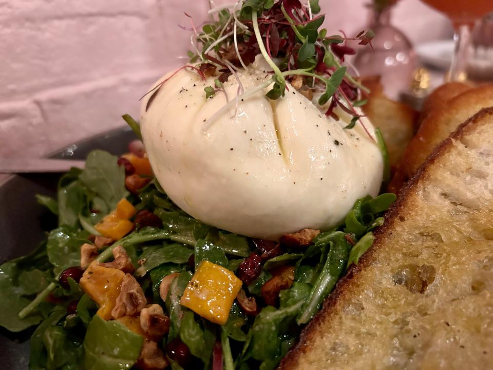 Heirloom's burrata appetizer changes with the seasons. The fall rendition features roasted squash, pomegranate seeds and hazulnuts.