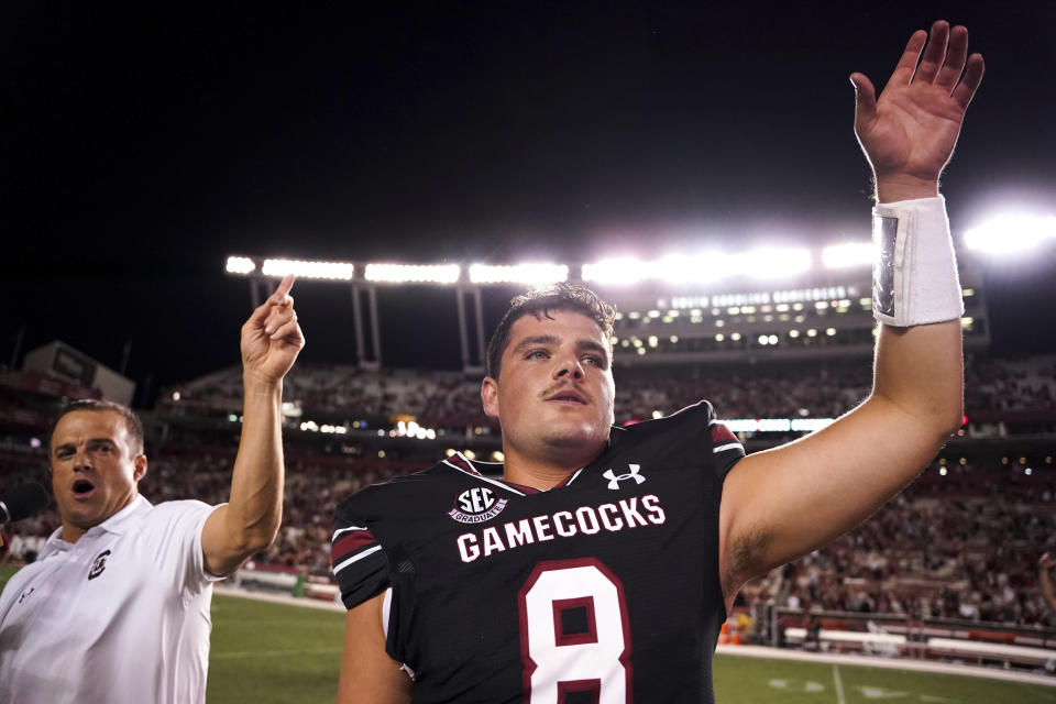 South Carolina quarterback Zeb Noland (8) and head coach Shane Beamer celebrate after a victory in an NCAA college football game against Vanderbilt, Saturday, Oct. 16, 2021, in Columbia, S.C. (AP Photo/Sean Rayford)