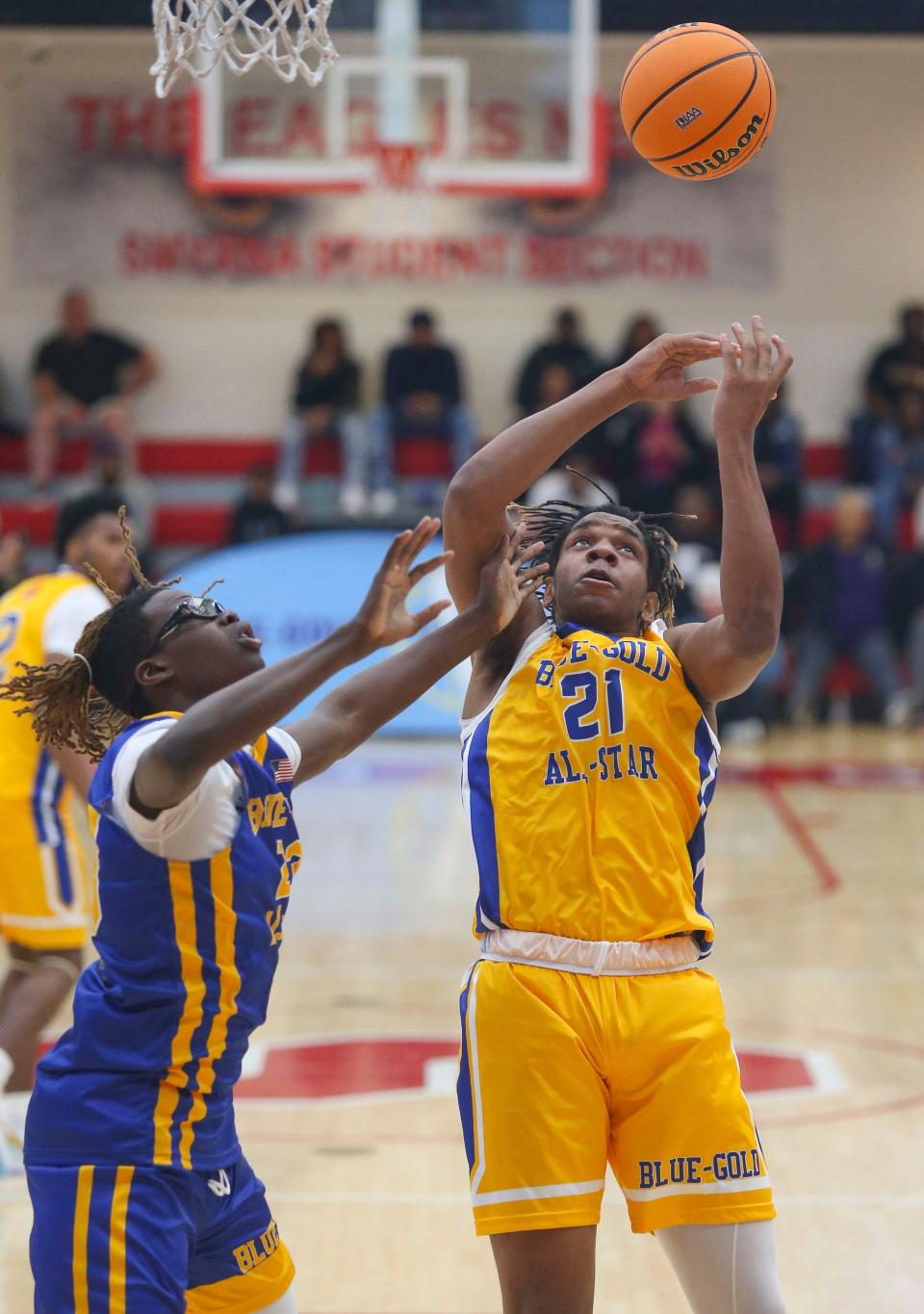 Blue's Jordan Spencer of Sanford (left) moves for a rebound with Gold's Clarence McBride-Allen of Sussex Central in the Blue-Gold All Star high school senior game at Smyrna High School, Saturday, March 16, 2024. The game benefits the Delaware Safety Council and the Delaware Interscholastic Basketball Coaches Association (DIBCA) scholarship fund.