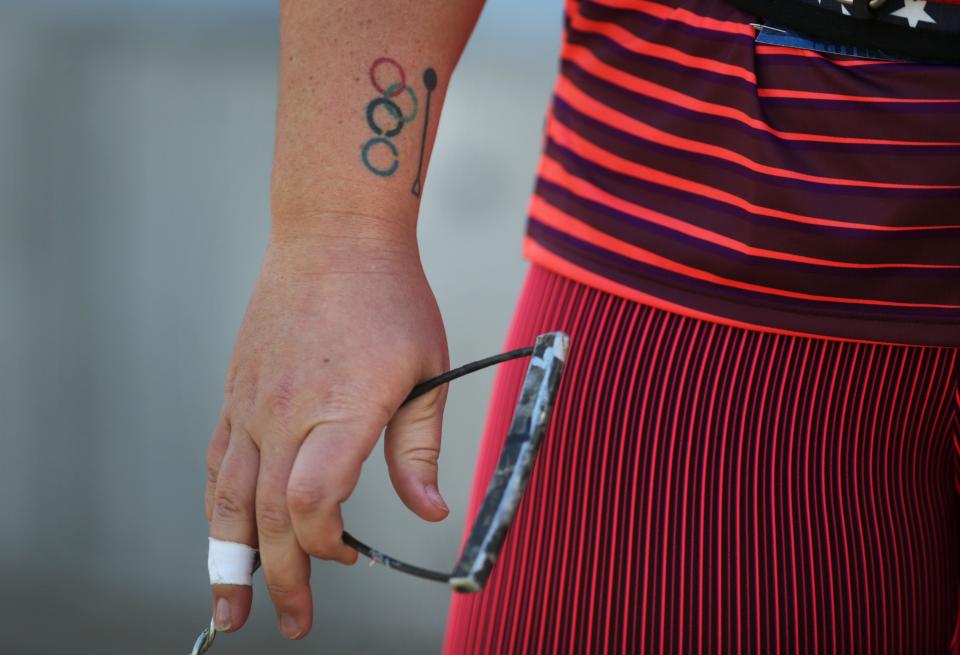 A tattoo of a hammer and the Olympic Rings are visible on the right arm of DeAnna Price as she warms up for the women's hammer throw on day one of the USA Track and Field Championships 2022 at Hayward Field in Eugene Thursday June 23, 2022. She came in fourth and will not represent the United States at the World Athletics Championships Oregon22 later this summer. 