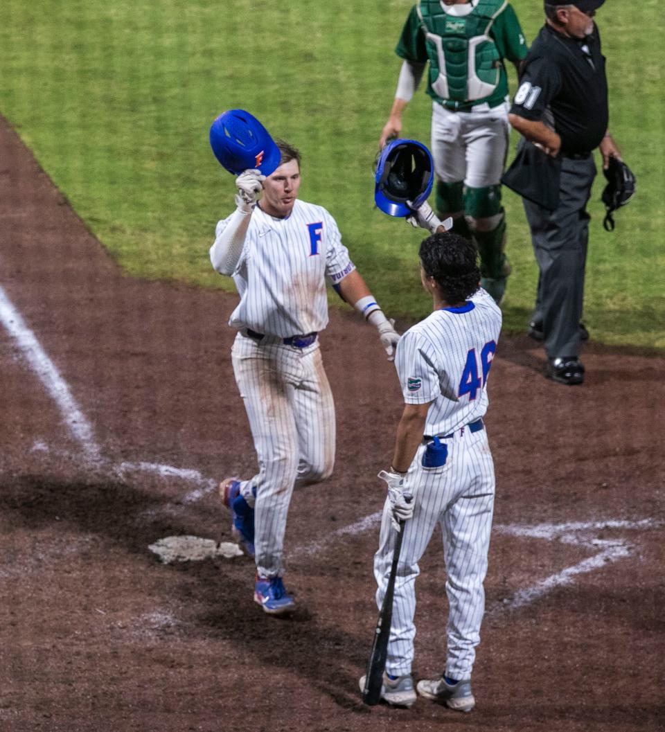 Florida's Tyler Shelnut (6) celebrates his home run with Armando Albert (46) in Game 2 of the Fall Ball doubleheader exhibition game against Stetson.