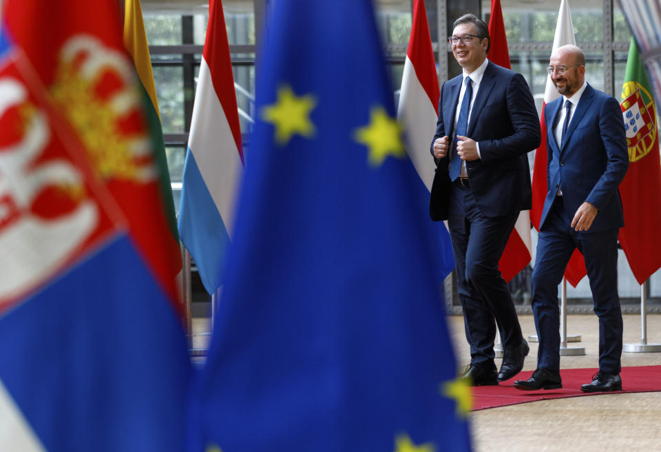 FILE - In this Friday, June 26, 2020 file photo, European Council President Charles Michel, right, walks with Serbian President Aleksandar Vucic prior to a meeting at the European Council building in Brussels. The leaders of Serbia and Kosovo resumed talks Sunday, July 12, 2020, via video conference with European Union foreign policy chief Josep Borrell in Brussels, aimed at normalizing their long-strained relations, more than 20 years after Belgrade sent troops into its former territory to crush an uprising by ethnic Albanian separatists. (AP Photo/Olivier Matthys, Pool, File)