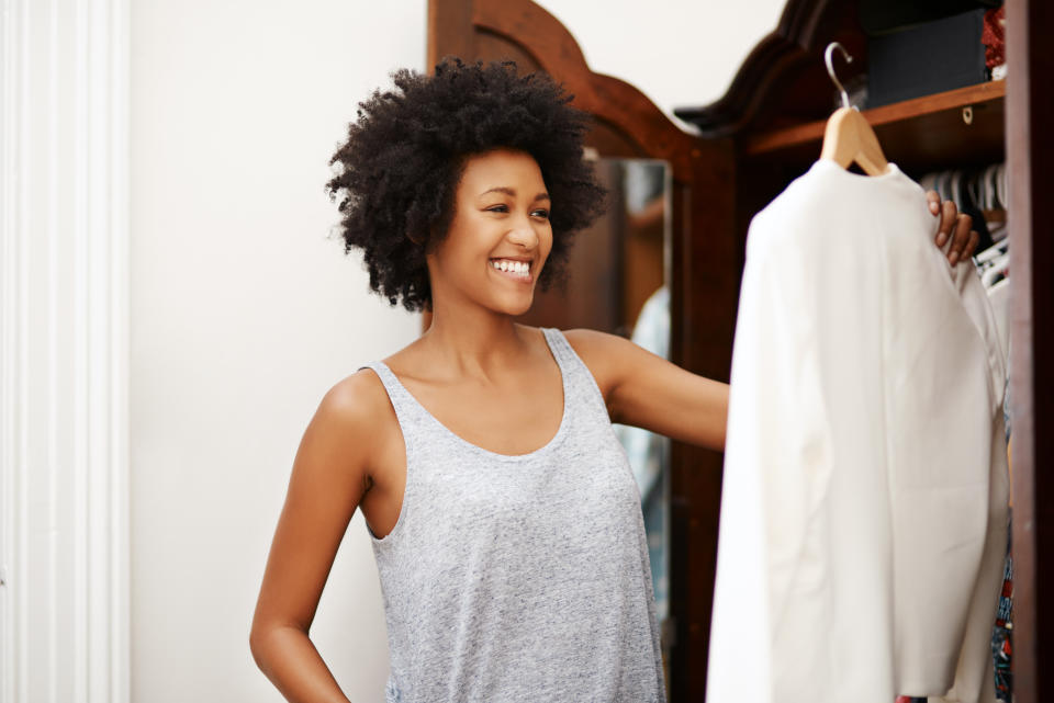 If you're in a small space, the good news is that you don't need a closet or a dresser to store clothes.  (Photo: PeopleImages via Getty Images)