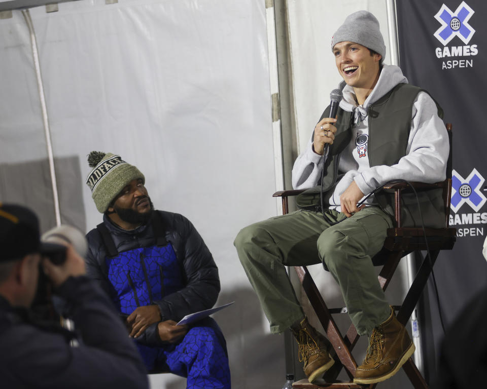 Australian snowboarder Scotty James, right, talks as host Selema Masekela listens during a news conference ahead of Winter X Games, Thursday, Jan. 26, 2023, in Aspen, Colo. (Austin Colbert/The Aspen Times via AP)