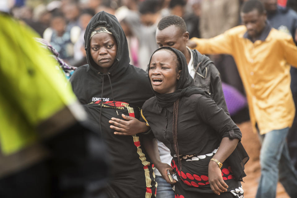 A woman is overcome by grief as she attends the burial ceremony of some of the people who lost their lives following heavy rains caused by Cyclone Freddy, in Blantyre, southern Malawi, Wednesday, March 15, 2023. After barreling through Mozambique and Malawi since late last week and killing hundreds and displacing thousands more, the cyclone is set to move away from land bringing some relief to regions who have been ravaged by torrential rain and powerful winds. AP Photo/Thoko Chikondi)