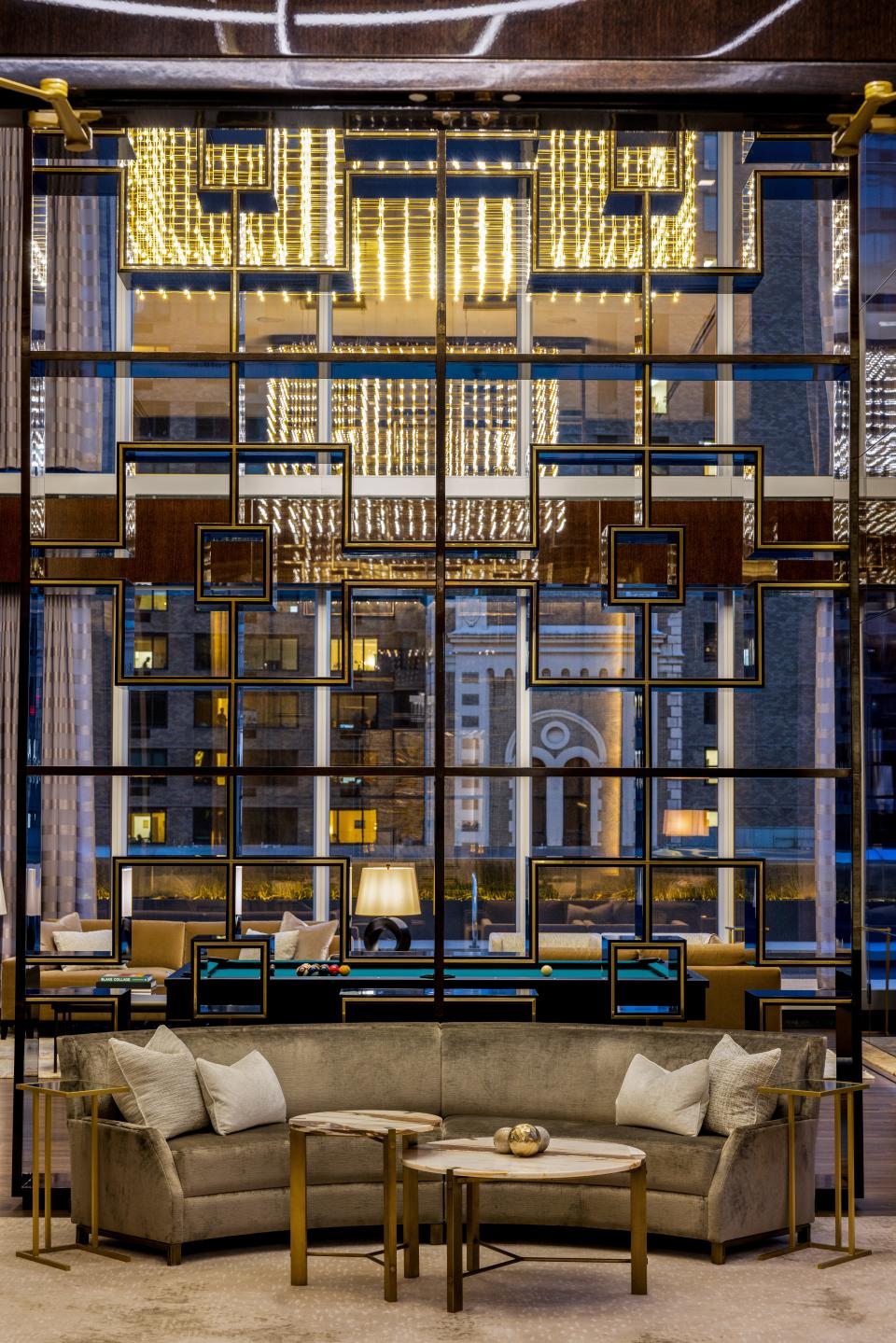 a gray couch on the 14th floor of luxury skyscraper Central Park Tower