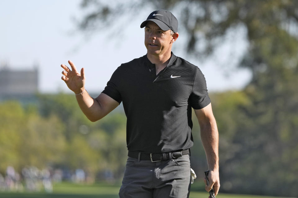 Rory McIlroy, of Northern Ireland, waves to the gallery after making a birdie putt on the 14th hole during the first round of The Players Championship golf tournament Thursday, March 14, 2024, in Ponte Vedra Beach, Fla. (AP Photo/Lynne Sladky)