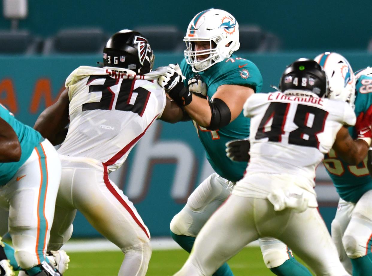 Miami Dolphins offensive tackle Liam Eichenberg (74) blocks Atlanta Falcons linebacker Tuzar Skipper (36) in the fourth quarter on Saturday, August 21, 2021 at Hard Rock Stadium in Palm Beach Gardens. [JIM RASSOL/palmbeachpost.com]