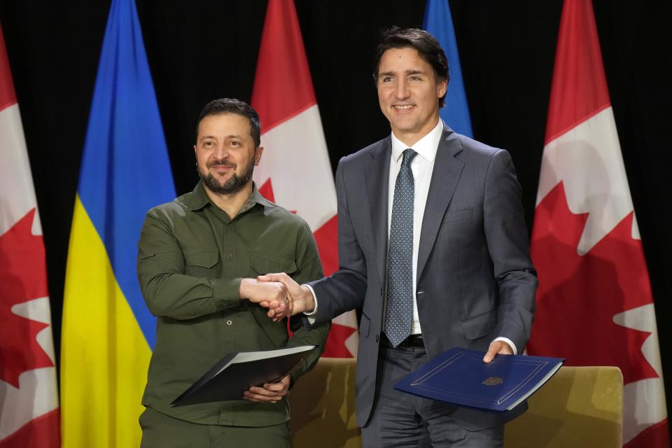 Ukraine's President Volodymyr Zelenskyy, left, and Canada's Prime Minister Justin Trudeau shake hands ahead of a joint press conference on Parliament Hill in Ottawa, Friday, Sept. 22, 2023. (Adrian Wyld/The Canadian Press via AP)