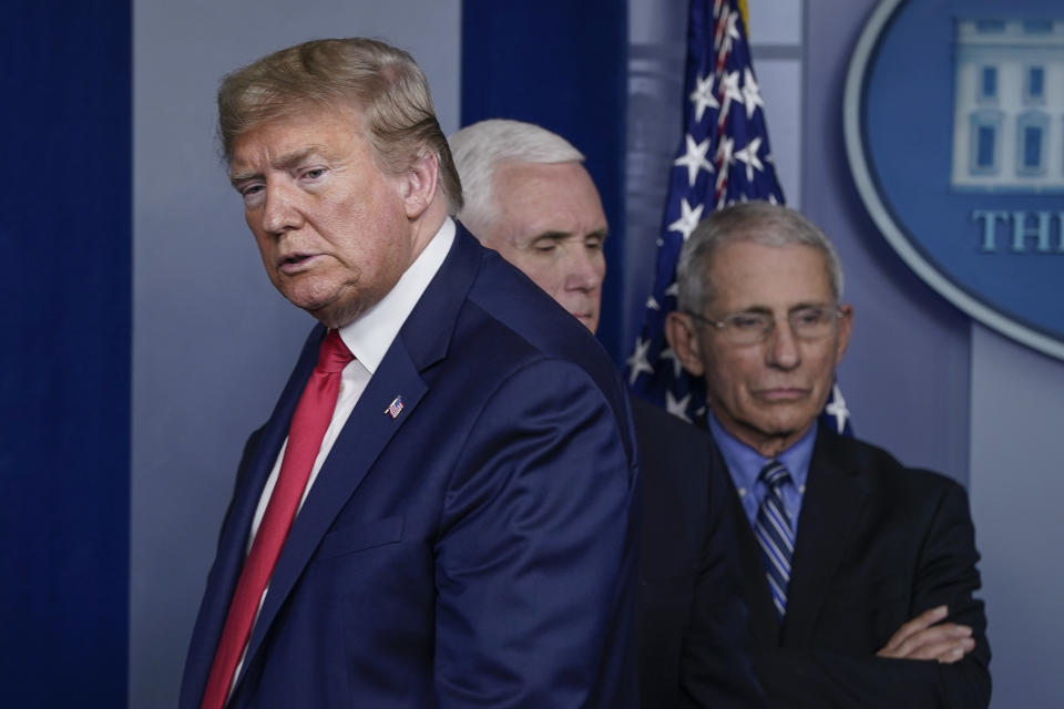 WASHINGTON, DC - MARCH 24: (L-R) U.S. President Donald Trump, Vice President Mike Pence, and Dr. Anthony Fauci, director of the National Institute of Allergy and Infectious Diseases, conclude a briefing on the coronavirus pandemic, in the press briefing room of the White House on March 24, 2020 in Washington, DC. Cases of COVID-19 continue to rise in the United States, with New Yorks case count doubling every three days according to governor Andrew Cuomo. (Photo by Drew Angerer/Getty Images)