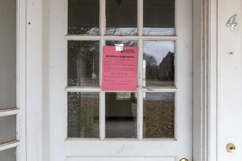 A gas cutoff notice hangs on the door of a building at Bacone College, on Jan. 8 2024, in Muskogee, Okla. Founded in 1880 as a Baptist missionary college focused on assimilation, Bacone College transformed into an Indigenous-led institution that provided an intertribal community, as well as a degree. (AP Photo/Nick Oxford)