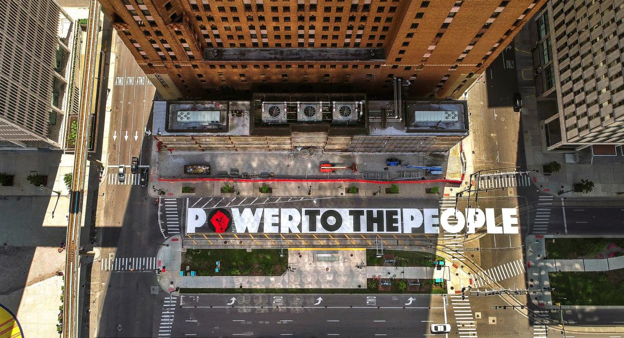 A Power To The People street mural on Woodward Avenue created for Juneteenth celebrations in June 2020. The mural was created by Hubert Massey and was painted by teenage students from around the Detroit area.