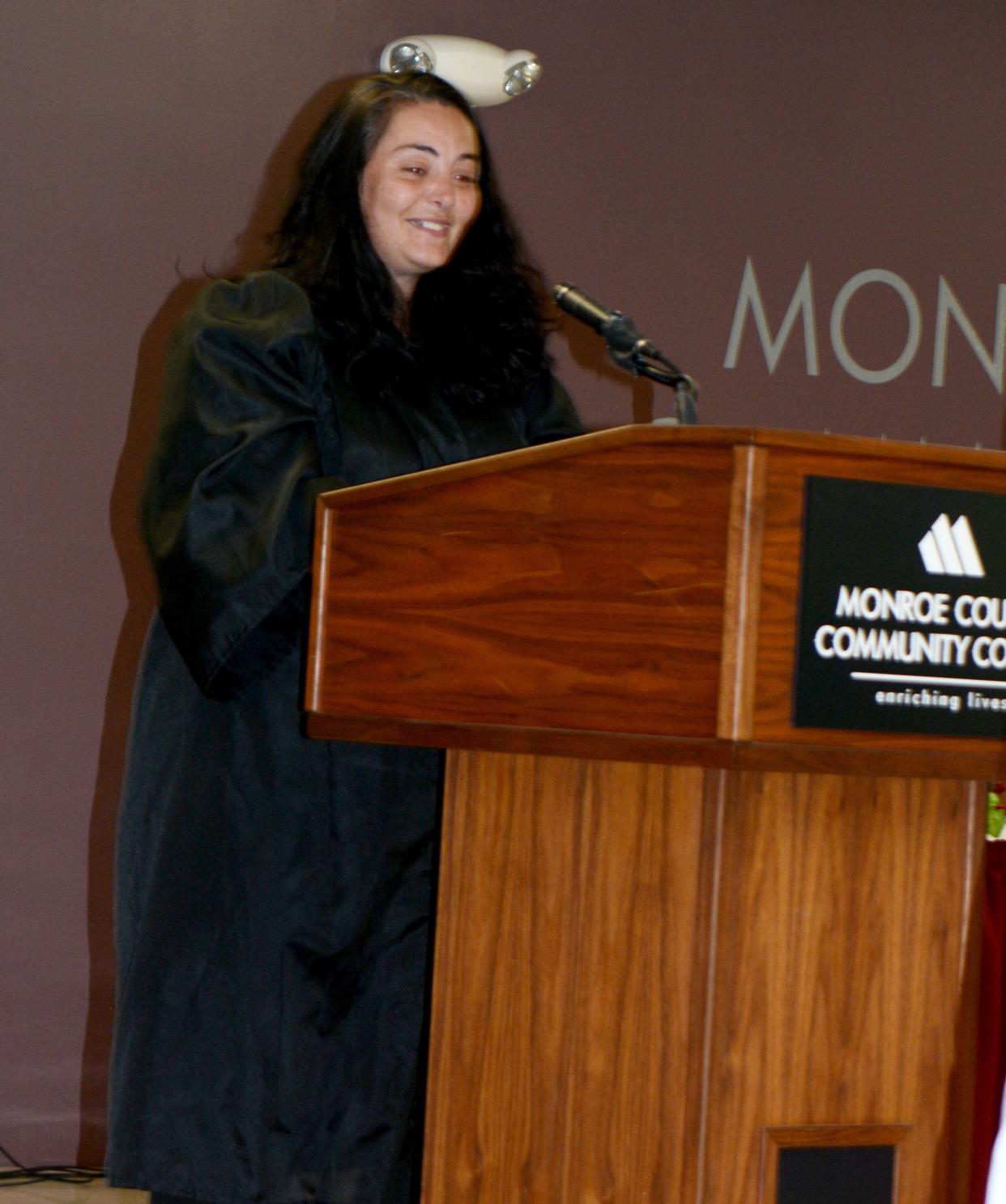 Charity Kelly was all smiles as she participated in a graduation ceremony held recently at Monroe County Community College. Kelly obtained her GED through a program offered by the Monroe County Learning Bank Network.